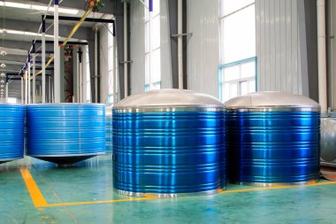 Blue stainless steel solar water heater in a production workshop 