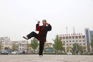 LUANNAN COUNTY, China - October 15, 2017: Taiji Sword performance in the square, LUANNAN COUNTY, Hebei Province, China