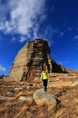 Inner Mongolia, China - October 2, 2017: Tourists visit Ashhatu Stone Forest in Keshiketeng World Geopark, Inner Mongolia, China