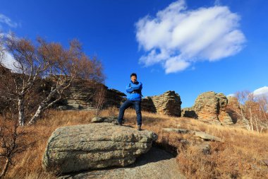 Inner Mongolia, China - October 2, 2017: Tourists visit Ashhatu Stone Forest in Keshiketeng World Geopark, Inner Mongolia, China