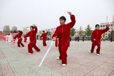 LUANNAN COUNTY, China - October 15, 2017: Taiji Sword performance in the square, LUANNAN COUNTY, Hebei Province, China