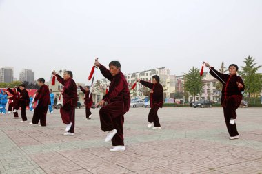 LUANNAN COUNTY, China - October 15, 2017: Taiji Sword performance in the square, LUANNAN COUNTY, Hebei Province, China