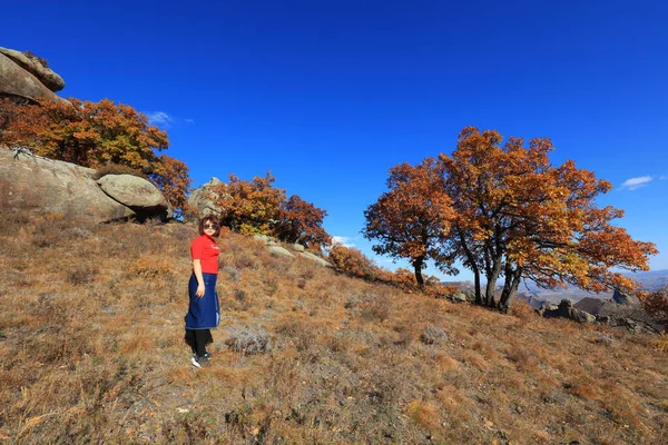 Inner Mongolia, China - October 3, 2017: tourists visit Qingshan Park, Keshiketeng World Geopark, Inner Mongolia, China