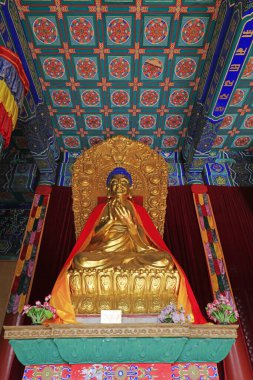 Yi County, China - November 5, 2017: The Buddha statue is worshipped in the Mahavira hall in a temple, Yi County, Hebei Province, China
