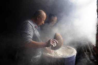 Luannan County - January 31, 2018: workers busy in producing vermicelli workshop, Luannan County, Hebei Province, Chin