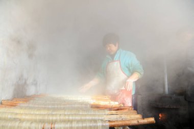 Luannan County - January 31, 2018: workers busy in producing vermicelli workshop, Luannan County, Hebei Province, Chin