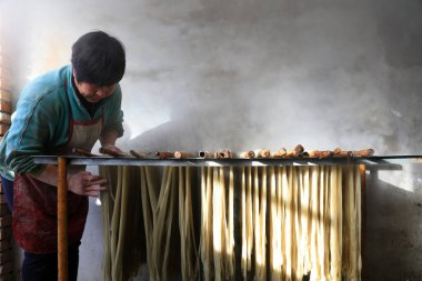 Luannan County - January 31, 2018: workers busy in producing vermicelli workshop, Luannan County, Hebei Province, Chin