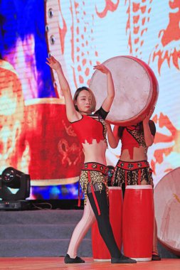 Luannan county - February 9, 2018: stirrup drum performance on stage, luannan county, hebei province, China