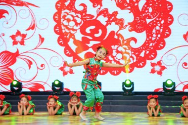 Luannan county - February 9, 2018: children dance performance on stage, luannan county, hebei province, China