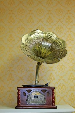 Old phonograph and copper trumpet, closeup of photo clipart