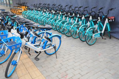 Beijing, China - April 10, 2021: bicycles are neatly displayed on the streets of Beijing. clipart