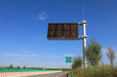 Warning signs on the side of the highway - 