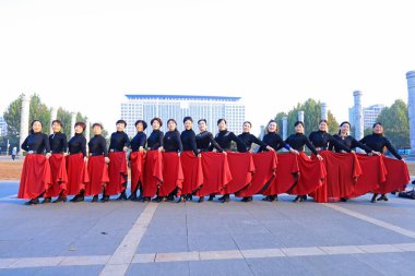 LUANNAN COUNTY, China - October 24, 2021: The beautiful ladies took a group photo in the square, North China clipart