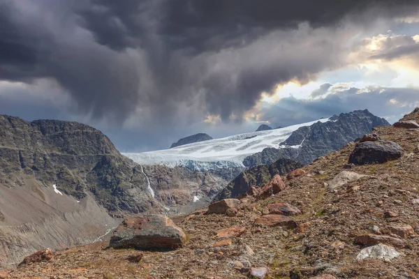 Gepatschferner at the Italian Austrian border under a dramatic sky, Vallelunga, Alto Adige - Sudtirol, Italy. The glaciers are in rapid retreat caused by global warming
