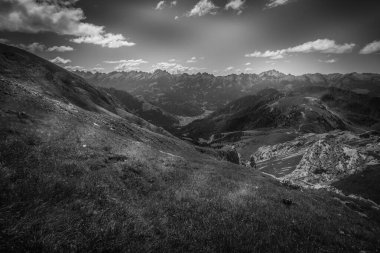 Black and white panorama of the Fiemme Valley towards Predazzo village. Lagorai mountain chain in the background. UNESCO world heritage site, Trentino-Alto Adige, Italy, Europe