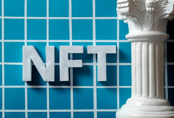 NFT letters and a Roman antique column in the vaporwave style. The concept of future technologies and digital art and cryptocurrency. High quality photo