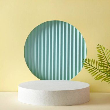 Geometric background podium for demonstration and advertising of the product on a yellow and blue background with a green plant. Minimal modern eco concept. High quality photo