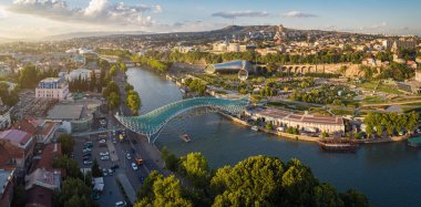 Aerial view of downtown Tbilisi, Georgia. In the foreground is the Peace Bridge over the Mtkvari River. clipart