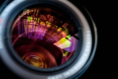 reflections in Photo Camera lens, isolated on black background clipart