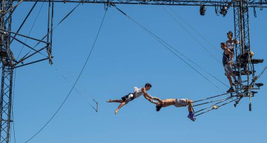 Sibiu City, Romania - 28 June 2022 trapeze artists acrobats from CirkVOST, on the metal scaffolding at the International Theatre Festival from Sibiu, Romania.