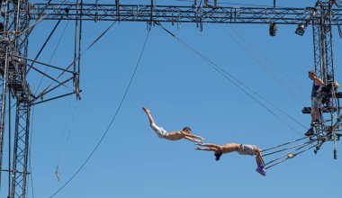 Sibiu City, Romania - 28 June 2022 trapeze artists acrobats from CirkVOST, on the metal scaffolding at the International Theatre Festival from Sibiu, Romania.