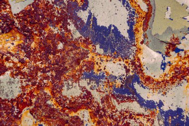 Bir arabanın üzerindeki boya ve pasın soyut makro görüntüsü