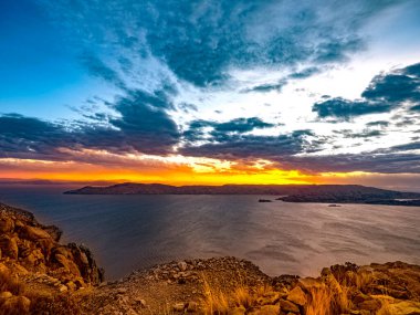 sunset on the shore of lake Titicaca, Peru