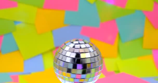 Globe Mirrors Spinning Colorful Sticky Notes Background — Video