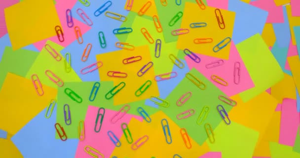 Multicolored Paper Clips Rotating Table Multicolored Paper Sticky Notes Post — Stockvideo