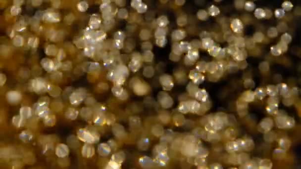 Goldener Glitzerhintergrund Zeitlupe Schöner Übergang Mit Echten Goldpartikeln Wind Auf — Stockvideo