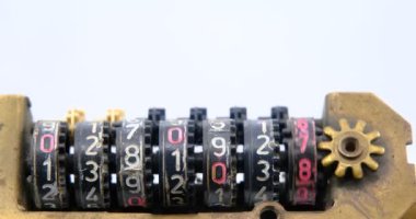 old mechanical counter with numbers on a white background