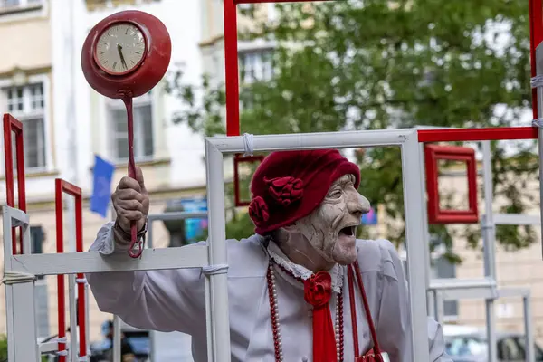 stock image Sibiu City, Romania - 23 June 2024.  street theater performance in the park, people with face masks