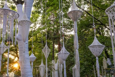 Sibiu City, Romania - 20 June 2024. artistic creations from the white canvas in the park, a public art project created entirely with reuse objects and materials clipart