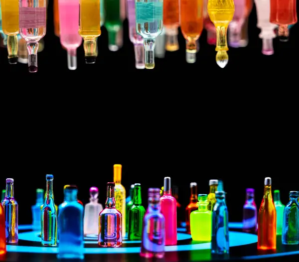 stock image various miniature bottles of alcohol without labels with black bacground