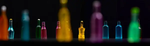 stock image various miniature bottles of alcohol without labels with black bacground