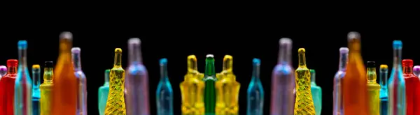 stock image various miniature bottles of alcohol without labels with black bacground