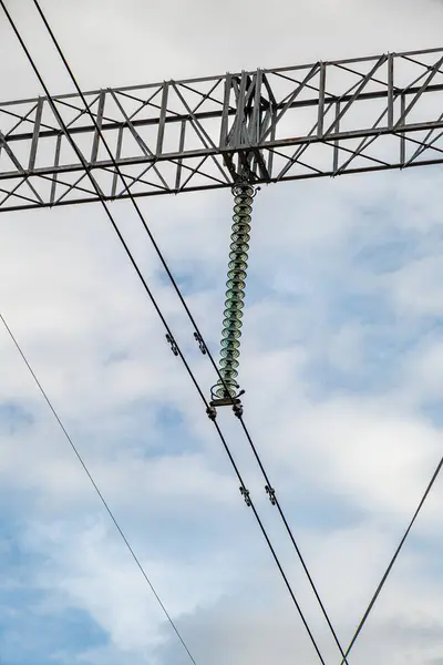 stock image High Voltage Electric Power Grid Poles with Ceramic Insulators at Transformer Substation with Corona discharge