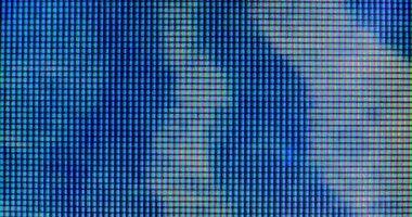 4K LED matris kırmızı, mavi ve yeşil alt piksellerin ekstrem makro görünümü, monitör veya TV ekranı. Renkli piksel dokusu soyut bir kalıp oluşturur.