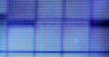 4K LED matris kırmızı, mavi ve yeşil alt piksellerin ekstrem makro görünümü, monitör veya TV ekranı. Renkli piksel dokusu soyut bir kalıp oluşturur.