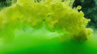 Colored ink in water form an abstract smoke pattern
