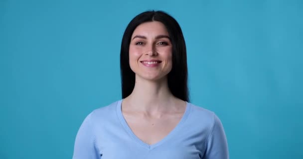 Portrait Woman Standing Blue Background Smiling Widely Her Teeth Showing — Stock Video