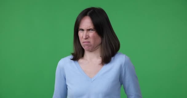 Caucasian Woman Standing Green Screen Looking Camera Seeing Something Repulsive — Stock Video