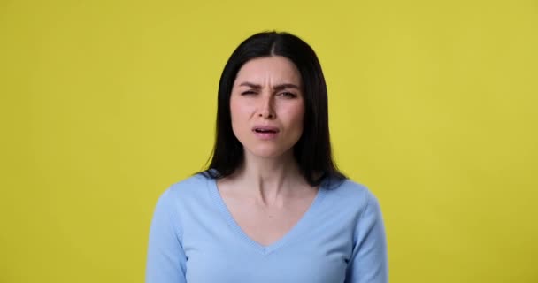 Caucasian Woman Stands Yellow Background Looking Camera Suddenly She Sees — Stock Video