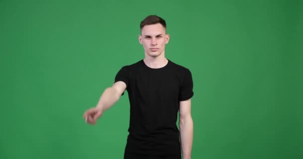 Green Background Stern Looking Caucasian Man Shakes His Finger Gesture — Stock Video