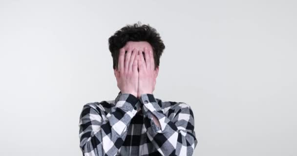 Curly Haired Caucasian Man White Background Stands Frozen Fear His — Stock Video