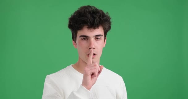 Calm Composed Caucasian Man Captivating Green Backdrop Gracefully Raises Finger — Stock Video