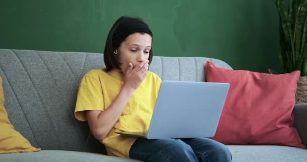 Cozy Living Room Schoolboy Sits Couch His Laptop Wearing Expression — Stock Video