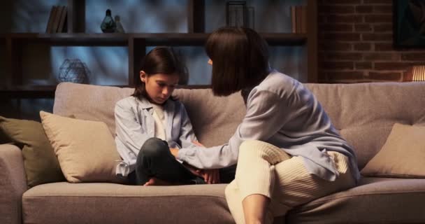 Caring Mother Sits Sofa Gently Comforting Son Tender Touch Reassuring — Stock Video