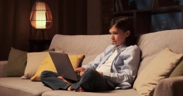 Self Assured Boy Sits Sofa Typing Confidence Laptop His Fingers — Stock Video