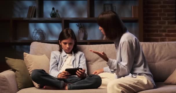 Mother Sits Sofa Face Stern Disapproving Scolding Son Who Engrossed — Stock Video
